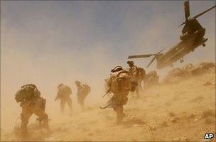 A CH-47 Chinook helicopter takes off after dropping soldiers in Bagh village of Khakeran Valley, Zabul province, Afghanistan