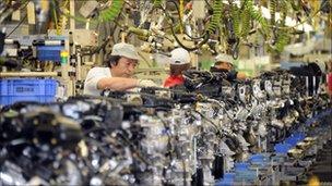 Factory workers assemble Nissan's VQ engines at the Iwaki engine plant in Iwaki, Fukushima prefecture, on May 17, 2011.