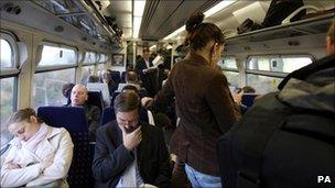 Passengers on a busy commuter train