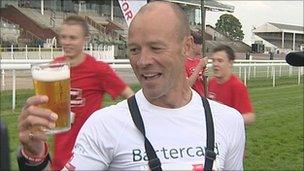 Andy McMenemy celebrates at the finish line