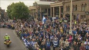 Fans watching Chester City's open bus tour