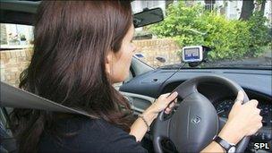 A woman driving a car