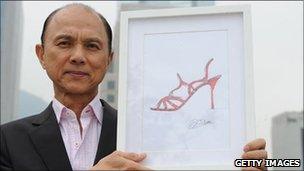 Shoemaker Jimmy Choo with a drawing of one of his creations