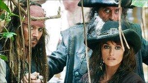 Johnny Depp with Ian McShane (behind) and Penelope Cruz in Pirates of the Caribbean: On Stranger Tides