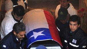 The coffin of Salvador Allende is removed from the family's crypt in in Santiago