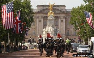 Soldiers on horseback march along the Mall in London, past US and British flags (23 May 2011)