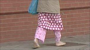 Woman wearing pyjamas on Middlesbrough street