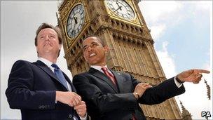 David Cameron speaking with Barack Obama outside the Houses of Parliament in London