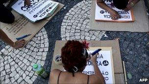 Portuguese and Spanish youths prepare flyers at a protest in Rossio Square, Lisbon, 23 May 2011