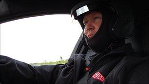 BBC reporter Jorn Madslien driving a Jaguar KFR at the Nurburgring