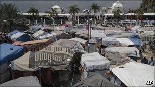 Tent city for people made homeless by Haiti's January 2010 earthquake, with the damaged National Palace in the background - 14 May 2011