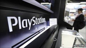 A man plays a game on Sony's PlayStation 3 game console