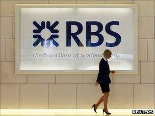 A worker in the foyer of a Royal Bank of Scotland office in London