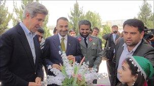 General Daud (centre, in uniform) with US Senator John Kerry (far left)