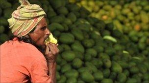 Man eats a mango