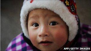 Picture of a Chinese child wearing a hat