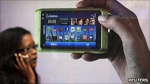 Shopper walking past Nokia advert