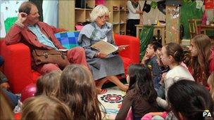 Michael Morpurgo listens as the Duchess of Cornwall tells a story