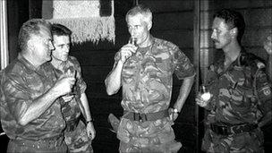 Lt Col Thom Karremans, centre, shares a toast with Ratko Mladic, left, on 12 July 1995