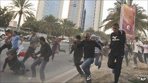 Protesters flee in Manama, 15 Feb