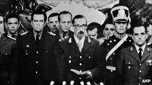 General Jorge Rafael Videla (C) before he was sworn in as Argentina's President, on 30 March after a military coup 24 March 1976