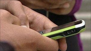 Person using mobile, BBC