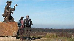 Two amateur surveyors look out across Nottinghamshire from the top of the Silverhill Wood. Photo: John Barnard