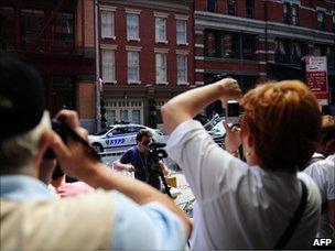 Tourists on Franklin St, where Dominique Strauss-Kahn is under house arrest in New York