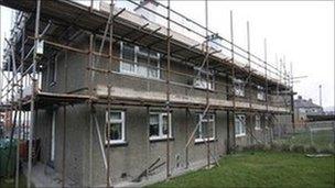 Homes with scaffolding outside