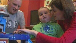 Ben Halford, with his parents Neil and Nicky in January 2010