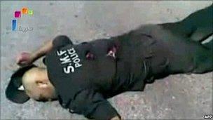 A grab from footage aired on Syria's state television on 7 June 2011 shows what it said was a policeman shot dead by "terrorist gangs" during a massacre in the town of Jisr al-Shughour on 6 June 2011. NB: Independent reporting on the ground is not allowed, so it is impossible to verify the account of either side.