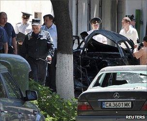 Moldovan security forces examine the scene of the blast in Chisinau, 7 June