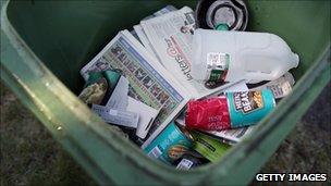 A wheelie bin filled with rubbish