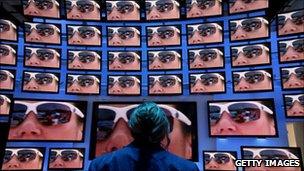 Woman looking at 3D screens