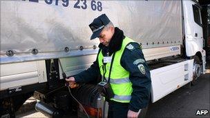 Bulgarian customs officer checks lorry on Bulgaria-Turkey border - file pic