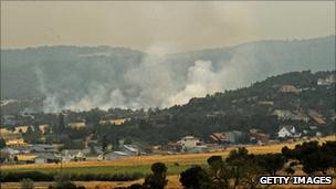 The Wall fire burns near the town of Eager