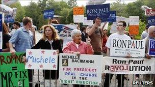 Supporters of Republican presidential hopefuls demonstrate in Manchester, New Hampshire, 13 June 2011.