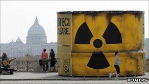 A giant mock nuclear waste barrel built by anti-nuclear protesters stands in central Rome, 7 June