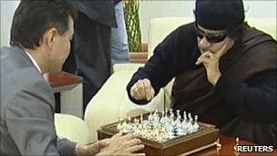 Muammar Gaddafi (R) playing chess with visiting president of the World Chess Federation Kirsan Ilyumzhinov, 12 June 2011