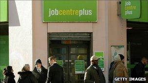 People queue outside a Job Centre Plus branch