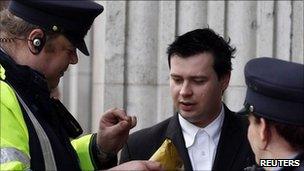 Police officers carrying out a stop and search