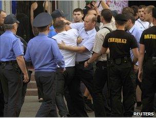 Police detain a man in Minsk, 15 June