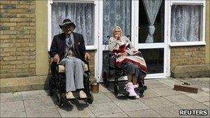 Residents sit outside a Southern Cross care home