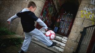 Child playing football