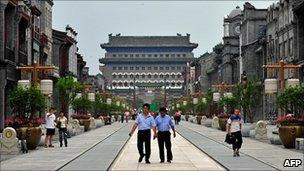 Visitors walk down the once historical Qianmen Street in one of Beijing's oldest neighbourhoods which has now been turned into a tourist attraction