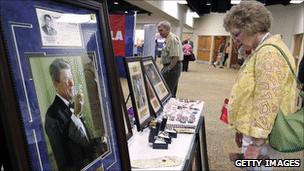 A woman looks at merchandise at the Republican Leadership Conference in New Orleans