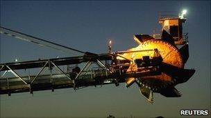 A reclaimer places coal in stockpiles after processing at Rio Tinto's mine