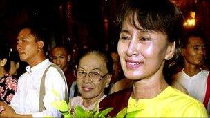 Aung San Suu Kyi walks with friends and family in Yangon