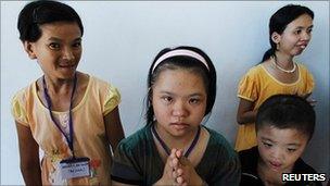 Agent Orange victims are seen at a hospice in Danang