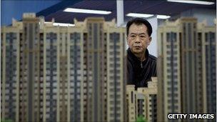 A man looks at some model flats